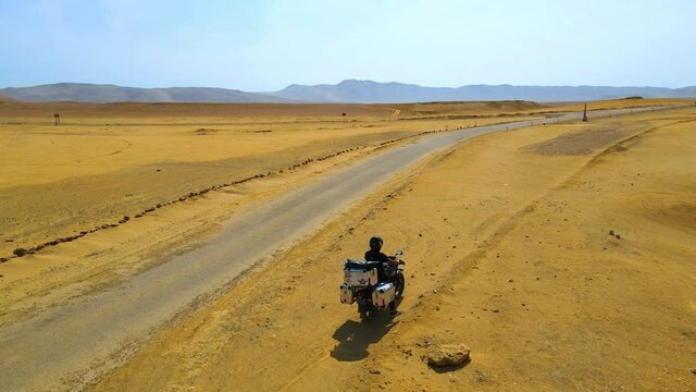 Motorcyclist in the Paracas Reserve in Ica - Pisco