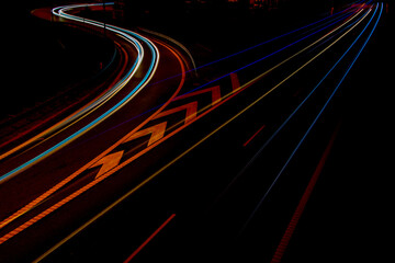 Night road lights. Lights of moving cars at night. long exposure red, blue, orange, multicolored