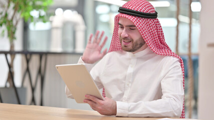 Professional Arab Businessman doing Video Call on Tablet in Office