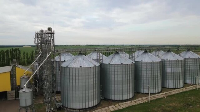 Grain storage in large silos aerial view. Silo with grain. Grain storage tank view from above