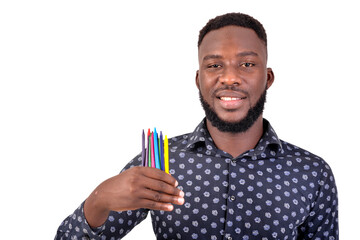 young man teacher showing color pencil smiling.
