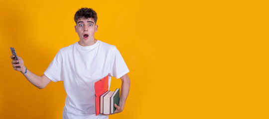 isolated teenage student with mobile phone and books with surprised expression