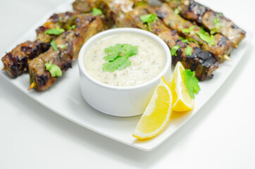 Pork shoulder kebabs with a lemon and herb rub and a garlic and mint yogurt sauce