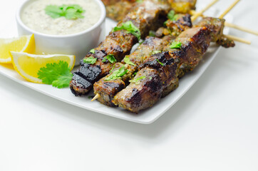 Pork shoulder kebabs with a lemon and herb rub and a garlic and mint yogurt sauce