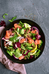 Fresh vegetable salad with salted salmon. Top view with copy space.