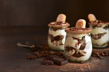 Delicious italian dessert tiramisu in a jars.