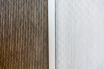 Side by side comparison of a dirty home air filter next to a clean white one; Filter replacement will maintain a good indoor air quality