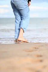 person walking on the beach