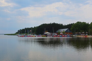 Dabki, Poland. Lake Bukowo. Lake marina. Canoes and pedal boats for rent at the lake marina. Water sports