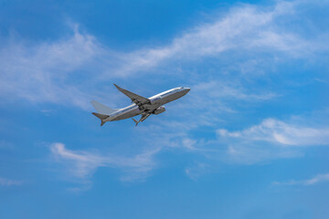 Fototapeta na wymiar Passenger airplane taking off into the sky