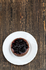 sweet piece of cake with black currant berries