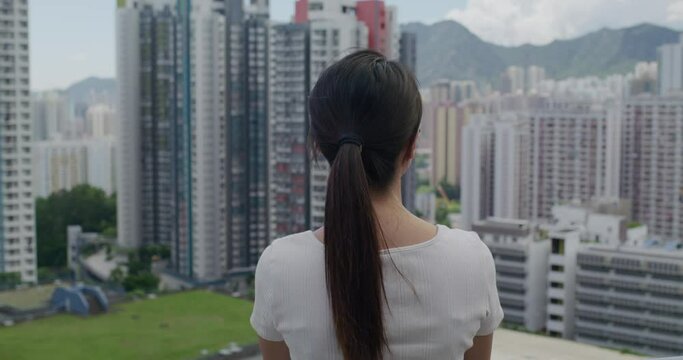 Woman look at the urban city