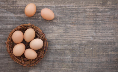 Basket fresh organic eggs. Healthy lifestyle. Wooden background.
