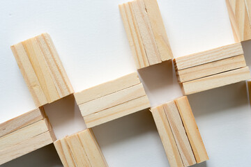 close up of loosely arranged wooden tiles on a white background