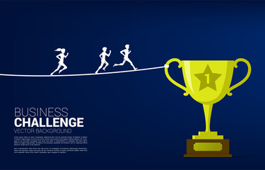 Silhouette of Businessman and businesswoman running on rope walk way to golden trophy .Concept for business risk and challenge.