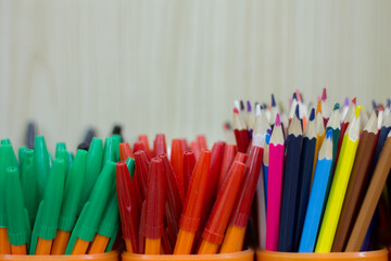 Fototapeta premium pencils and pens in cups. office supplies close up.