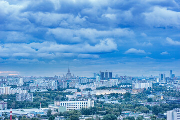 Aerial city view at rainy evening time.