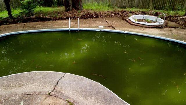 Abandoned swimming pool in disrepair