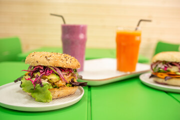 Vegan burger with Peruvian recipe of avocado and lettuce, purple onion and purple cabbage and secret ingredient