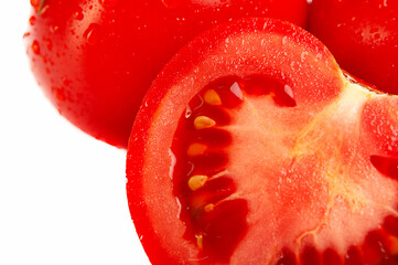Fragments of ripe juicy tomatoes in a cut, close-up