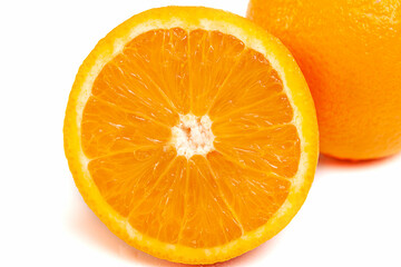Orange close-up on a white background, cut and whole