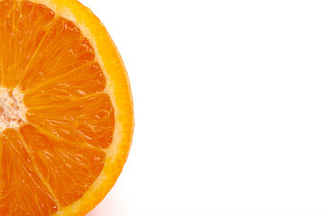 A fragment of an orange in a cut, close-up, on a white background, with free space for text
