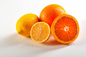 Oranges and lemons on a white background