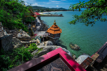 The background of modern design chairs is reflected on the cement floor, placed for viewing the scenery on the building or various attractions.