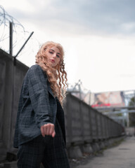 Young blonde girl on the street. Beauty and youth