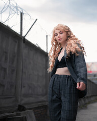 Fototapeta premium Young blonde girl on the street. Beauty and youth