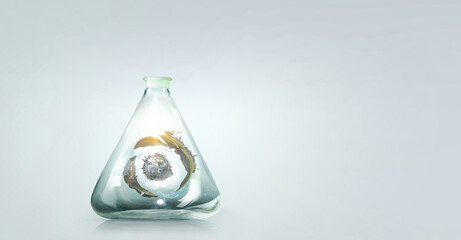 Green sphere landscape inside glass bottle . Mixed media . Mixed media