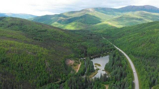 4K Drone Video (truck shot) of Mountains along Chena Hot Springs Road near Entrance of Resort outside Fairbanks, Alaska in Summer