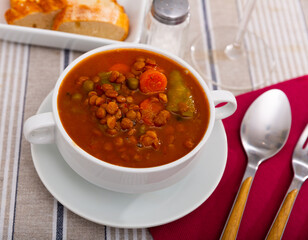 Homemade vegan lentil soup with vegetables, top view