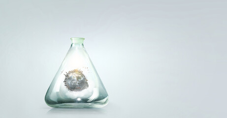 Green sphere landscape inside glass bottle