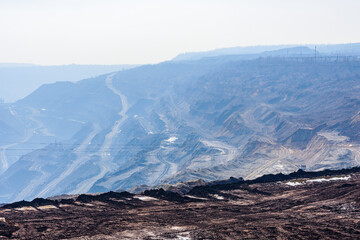 View on iron ore quarry in a dust haze