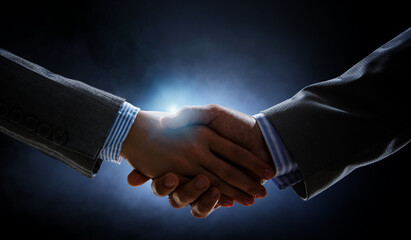 Partnership concept. Image of handshake