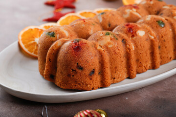 Delicious Homemade English Fruit Cake Loaf Pudding with Dried Mixed Fruit, Sultanas, Raisins, and Chopped Almond. Served during Christmas Party or New Year Eve