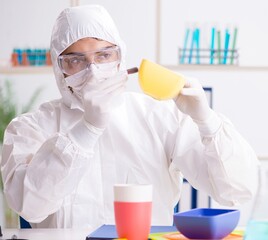 Chemist checking and testing plastic dishes