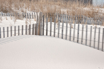 New Jersey Island Beach state park attempts to protect the massive and endangered sand dunes from wind and wave erosion, as well as human foot traffic with these wooden slat storm fencing