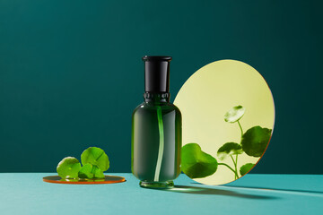 Blank bottle for mockup. Cosmetics product with centella asiatica (gotu kola) extract in dark green...