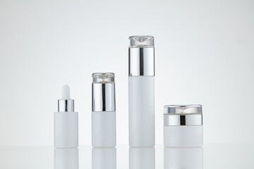 White cosmetic bottle on white background. Blank label used for design