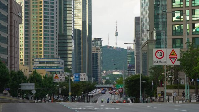 Scenic Distant View Between Buildings Of N Seoul Tower On Namsan Mountain From Downtown City Of Seoul In South Korea. static, wide shot