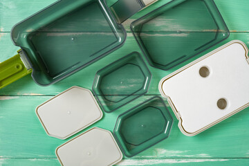 top view plastic takeout lunch box with individual containers with the lids opened