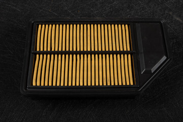 side view air filter for a car on a dark background