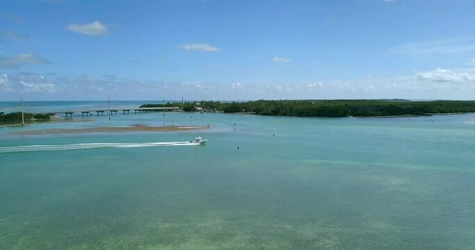 Drone shot of boat cruising near Robbie's Marina in Islamorada, Florida Keys.