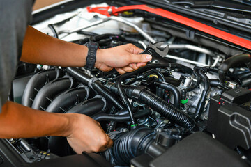 Fototapeta na wymiar Mechanic examining and maintenance the engine car , transportation repair service center