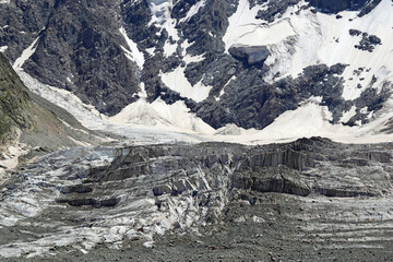 View of the glacier Mizhirgi. The Northern wall of the Mijirghi massif. Caucasus mountains.