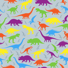A set with different types of dinosaurs. Bright multicolored silhouettes of dinosaurs on a gray background, seamless pattern. Fashionable print for children's fabrics and clothing.