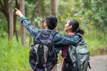 Portrait of couple teens asian backpacker a travel and relaxing in the forest, Concept of relax and travel
