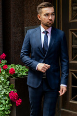 Man walking posing in fashionable autumn suit